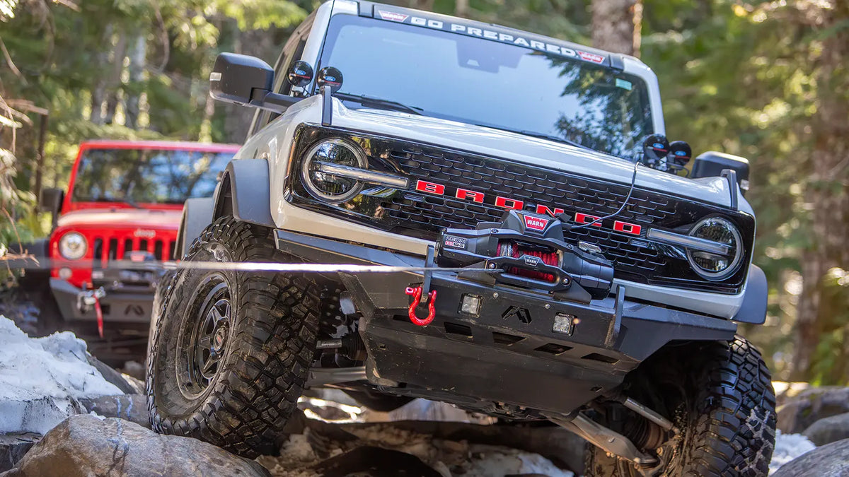 WARN ZEON XD 10-S 10,000 lb truck, Jeep, and SUV winch shown in rocky off-road terrain