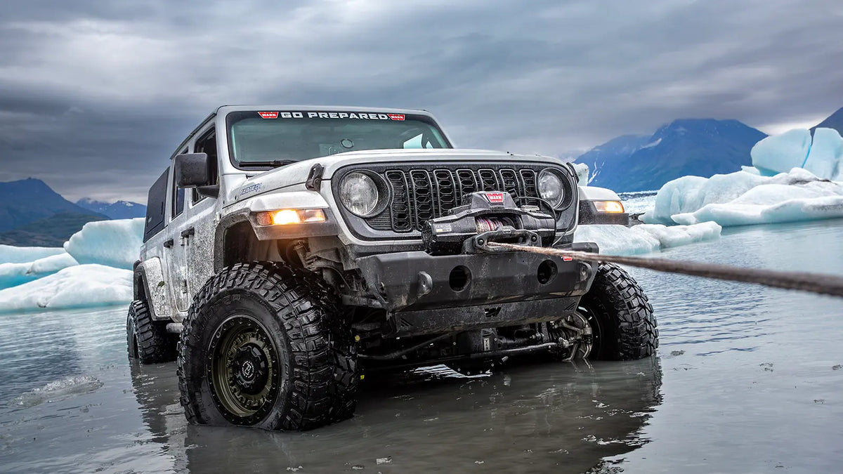 WARN ZEON XP 10-S 10,000 lb truck, Jeep, and SUV winch shown in snowy off-road conditions