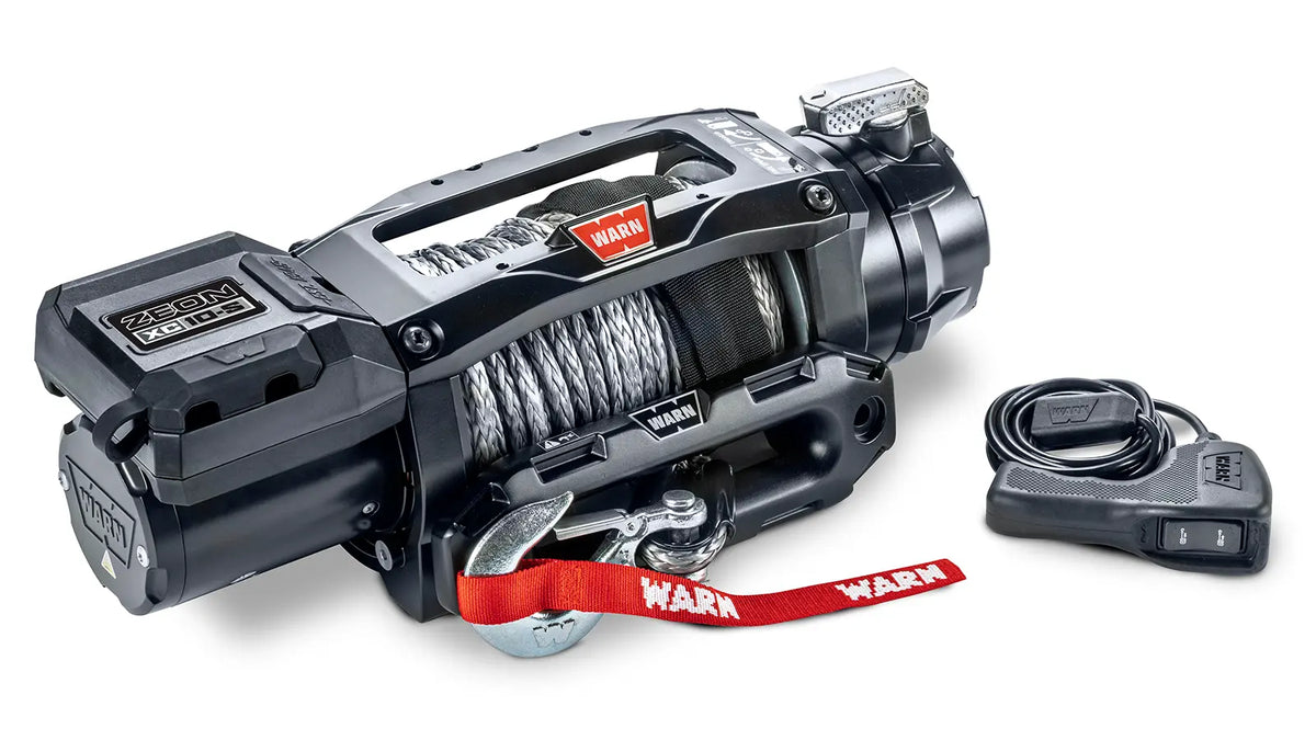 Angled view of the WARN ZEON XC 10-S 10,000 lb truck, Jeep, and SUV winch with 100 ft synthetic rope and hawse fairlead