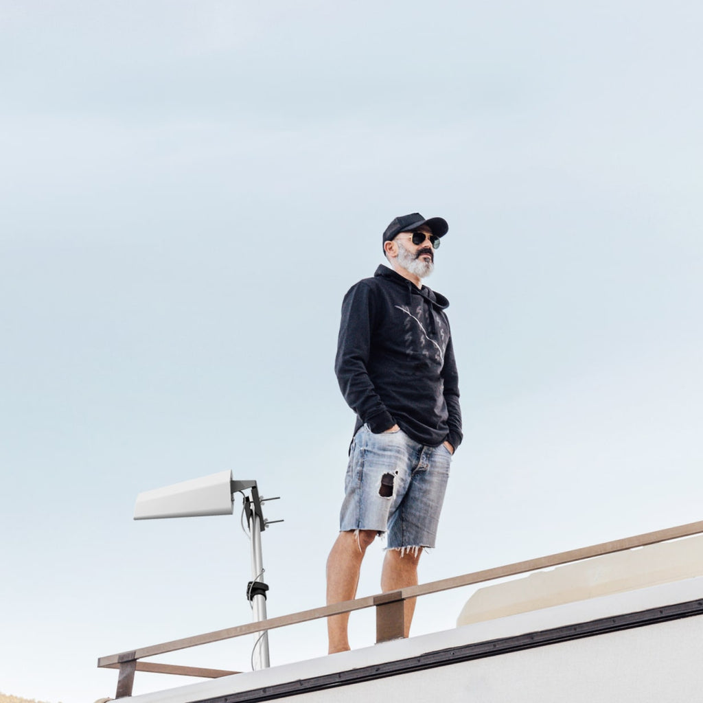 weBoost Destination RV - man next to destination rv antenna